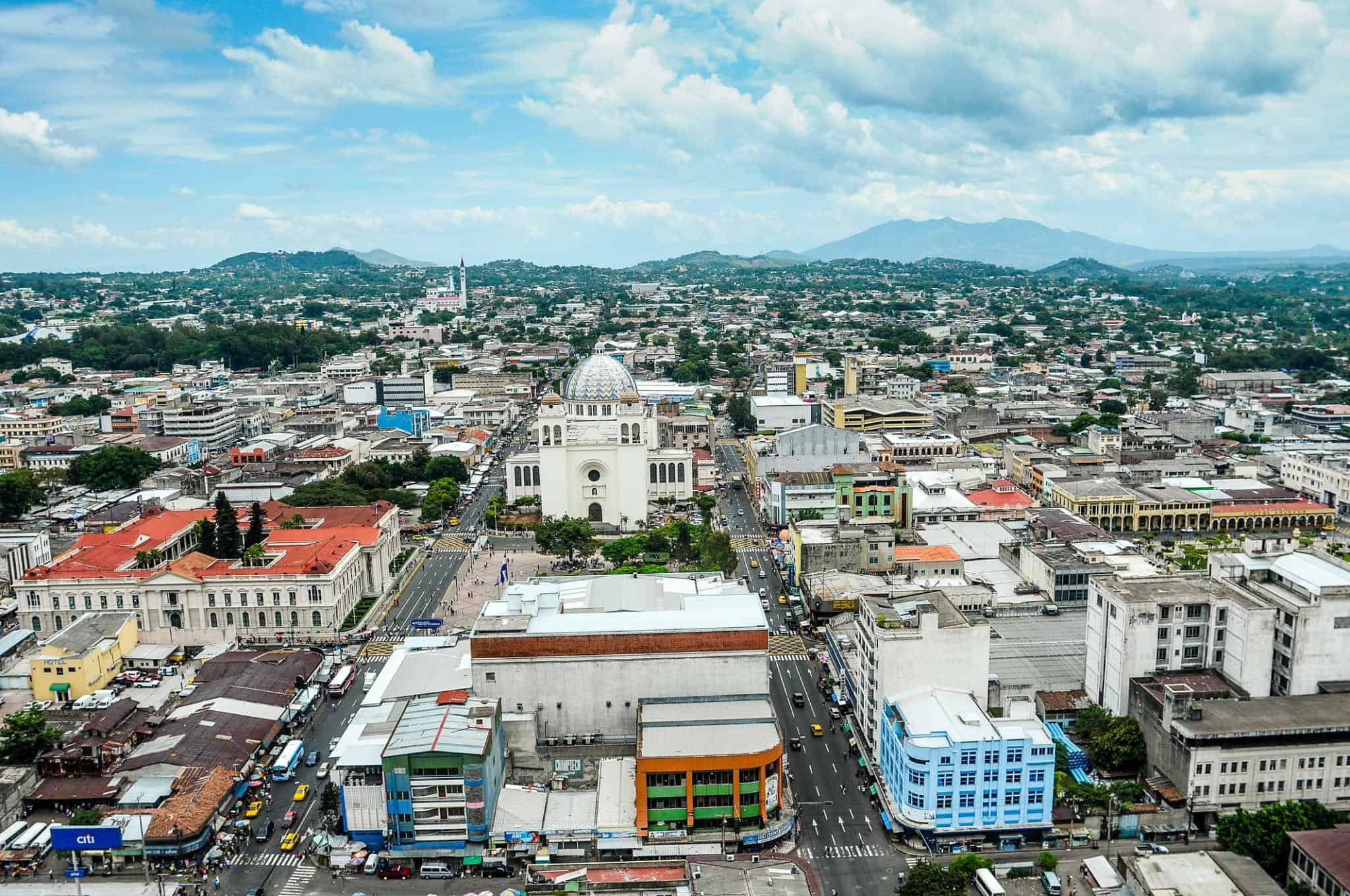 Aerial view of bustling San Salvador city with prominent landmarks