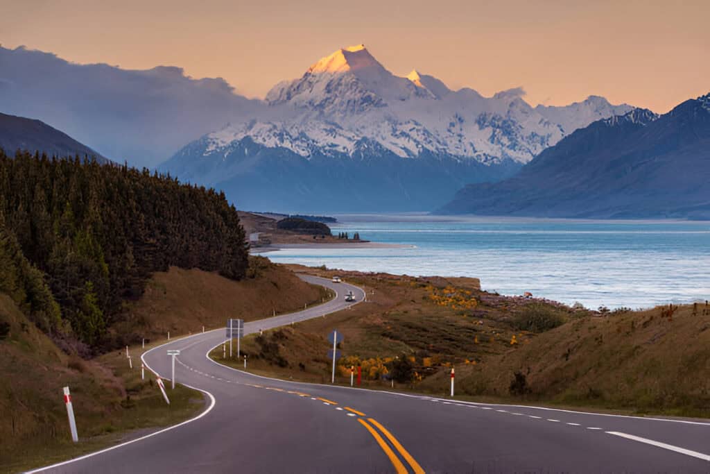 The majestic peak of Mount Cook, New Zealand, surrounded by snow-covered landscapes.